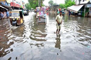 A view of rainwater accumulated on the road outside Railway Station due to heavy rain in the city.