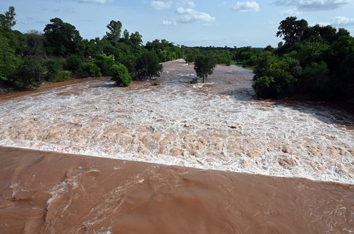 A view of the increased water level in Korang Nullah adjacent to Rawal Dam, where spillways have been opened as a precautionary measure due to rising water levels in the dam