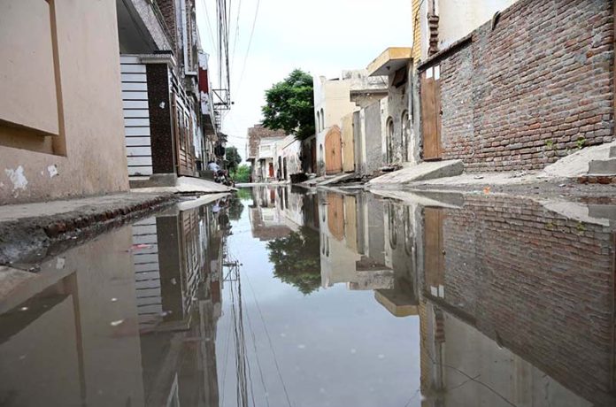 A view of stagnant sewage water accumulated in the street at Tiwana Park due to a choked drainage system; it needs the attention of the concerned authorities