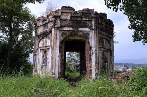A view of the historic Kuri Baradari located at Kuri Village, believed to have been built during the reign of Maharaja Ranjit Singh (1799–1840). The octagonal structure, set on an elevated plinth, features foliated pillars, arched entrances from four directions, and a staircase of eleven steps on its eastern side. Traces of Sikh-era frescoes—depicting Guru Nanak with companions Bala and Mardana—can still be seen on its inner and outer walls, despite defacement and deteriorating plaster. The ceiling remains adorned with fading floral designs and a Gurmukhi inscription is visible on the western outer panel