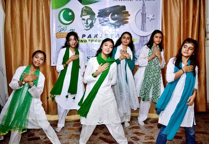Students are performing tableau during program at Royal School System in connection with 78th Independence Day and Maarka-e-Haq celebrations