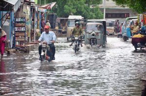 A view of rainwater accumulated on the road outside Railway Station due to heavy rain in the city.
