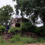 A view of the historic Kuri Baradari located at Kuri Village, believed to have been built during the reign of Maharaja Ranjit Singh (1799–1840). The octagonal structure, set on an elevated plinth, features foliated pillars, arched entrances from four directions, and a staircase of eleven steps on its eastern side. Traces of Sikh-era frescoes—depicting Guru Nanak with companions Bala and Mardana—can still be seen on its inner and outer walls, despite defacement and deteriorating plaster. The ceiling remains adorned with fading floral designs and a Gurmukhi inscription is visible on the western outer panel