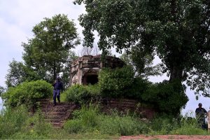 A view of the historic Kuri Baradari located at Kuri Village, believed to have been built during the reign of Maharaja Ranjit Singh (1799–1840). The octagonal structure, set on an elevated plinth, features foliated pillars, arched entrances from four directions, and a staircase of eleven steps on its eastern side. Traces of Sikh-era frescoes—depicting Guru Nanak with companions Bala and Mardana—can still be seen on its inner and outer walls, despite defacement and deteriorating plaster. The ceiling remains adorned with fading floral designs and a Gurmukhi inscription is visible on the western outer panel