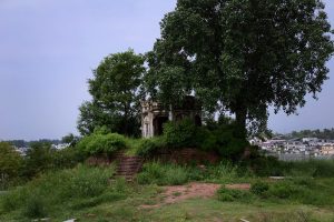 A view of the historic Kuri Baradari located at Kuri Village, believed to have been built during the reign of Maharaja Ranjit Singh (1799–1840). The octagonal structure, set on an elevated plinth, features foliated pillars, arched entrances from four directions, and a staircase of eleven steps on its eastern side. Traces of Sikh-era frescoes—depicting Guru Nanak with companions Bala and Mardana—can still be seen on its inner and outer walls, despite defacement and deteriorating plaster. The ceiling remains adorned with fading floral designs and a Gurmukhi inscription is visible on the western outer panel