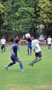 Players of Faisalabad Blue and Faisalabad White in action during a football match held under the Independence Day & Marka-e-Haq Sports Competition at Divisional Public School & College ground.