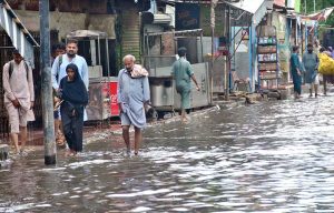 A view of rainwater accumulated on the road outside Railway Station due to heavy rain in the city.