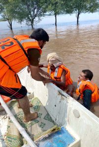 Rescue 1122 personnel evacuate residents and their animals from flood-hit areas to safer locations after the River Chenab overflowed, as rising water levels triggered by heavy rains and the opening of Indian floodgates crossed the danger mark