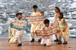 Students perform a tableau on a national song during the Marka-e-Haq and 78th Independence Day celebrations organized by the Workers Welfare Fund at the National Library Auditorium