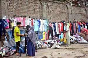 Women busy shopping of used clothes near Nolakha Landa Bazaar.