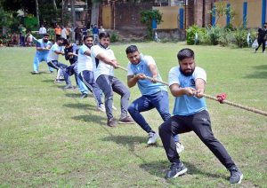 A tug-of-war match between Commissioner-XI and Government College University Faisalabad-XI, held in connection with the Independence Day and ‘Maarka-e-Haq’ Sports Competition at the GCUF hockey ground.