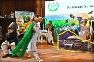 Students singing a national song during the Marka-e-Haq and 78th Independence Day celebrations organized by the Workers Welfare Fund at the National Library Auditorium