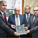 Federal Minister for Investment, Qaiser Ahmad Sheikh, witnessing the exchange of documents after the signing of MoUs for integrating Federal and Provincial Regulators with SECP’s E-Service Portal at the PMU (CPEC-ICDP)-BOI Board Room, Evacuee Trust Complex