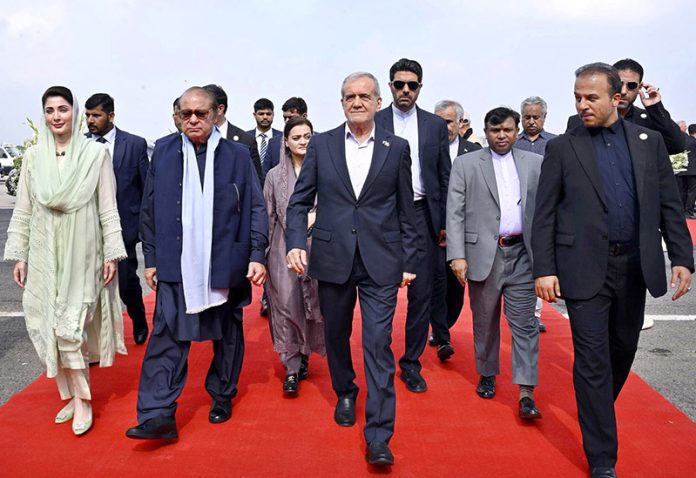 Iranian President Dr Masoud Pezeshkian arrives in Lahore Pakistan. Punjab Chief Minister, Maryam Nawaz and PML-N President, Mian Nawaz Sharif receive the Iranian President at Lahore Airport.