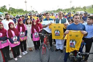 Participants taking part in Azadi Cycling Championship organized by the Directorate of Municipal Administration and Sports Directorate CDA at D-Chowk in the Federal Capital