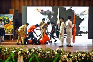 Students singing a national song during the Marka-e-Haq and 78th Independence Day celebrations organized by the Workers Welfare Fund at the National Library Auditorium