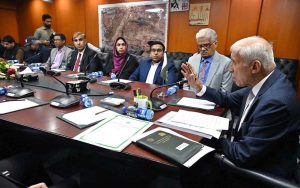 Federal Minister for Investment, Qaiser Ahmad Sheikh, witnessing the exchange of documents after the signing of MoUs for integrating Federal and Provincial Regulators with SECP’s E-Service Portal at the PMU (CPEC-ICDP)-BOI Board Room, Evacuee Trust Complex
