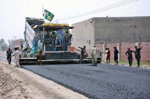 Labourers are busy in construction work of Sargodha Road with the help of heavy machinery during development work in the city.