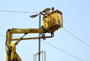 PDA stuffers busy in maintenance of street lights at Ring road.