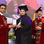 Federal Minister for Education and Professional Training, Dr. Khalid Maqbool Siddiqui, awards a medal to a high-achieving student during the 25th Convocation of NUML