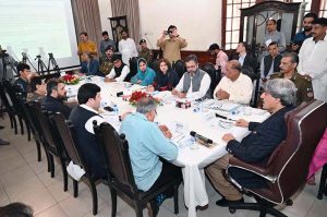 Chairman Senate Housing Committee, Senator Nasir Butt, chairs a meeting regarding illegal occupants of government-owned property at various locations, accompanied by Senators Pervaiz Rashid and Niaz Khan at Chamba House.