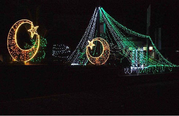 Government buildings, public squares, and private premises illuminated with vibrant decorative lights in connection with Independence Day celebrations