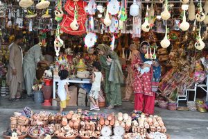 People busy shopping during the three-day annual celebrations of the 320th Urs of Hazrat Shah Abdul Latif Kazmi, popularly known as Bari Imam, in the Federal Capital