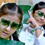 Girls having costumes in the colors of national flag of Pakistan to celebrate the 78th Independence Day of Pakistan in the city