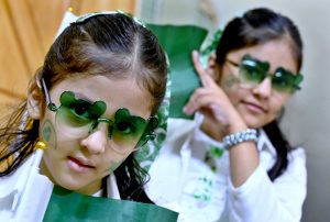 Girls having costumes in the colors of national flag of Pakistan to celebrate the 78th Independence Day of Pakistan in the city