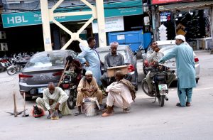 Daily wage workers waiting to get job for livelihood at Jail Road.