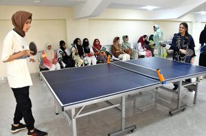 A student makes a decisive move with chess piece during a chess match at the indoor sports festival, held as part of the Pakistan Independence Day and ‘Maarka-e-Haq’ ccelebrations at LUMHS Jamshoro.