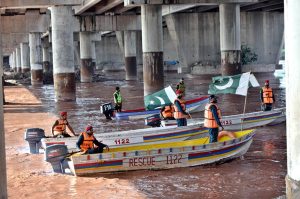 Rescue personnel are conducting flood response training exercises in the River Ravi to prepare for unforeseen emergencies.