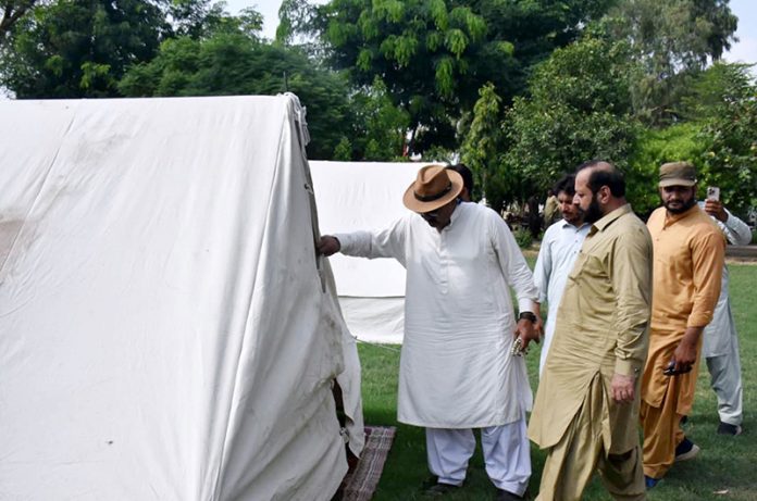 Federal Minister and Chairman Parliamentary Committee Kashmir Affairs Rana Mohammad Qasim Noon is visiting the camps for flood affectees at Jalalpur Pir Wala
