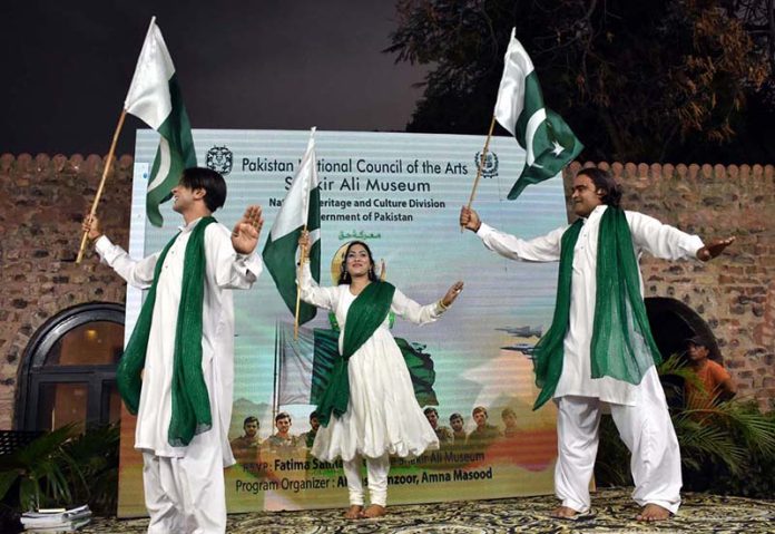 Artists performing during the Marka-e-Haq Independence Day celebrations at Shakir Museum late at night