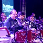Famous singer Rahat Fateh ali Khan performing during mega event of Pakistan independence day & Marka-e-Haq grand celebration at Rani Bagh