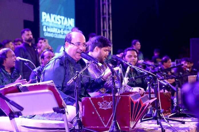 Famous singer Rahat Fateh ali Khan performing during mega event of Pakistan independence day & Marka-e-Haq grand celebration at Rani Bagh