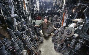 Vendor displaying and selling different vehicles spare parts to attract the customers at Shoba Bazar.