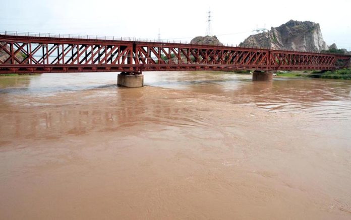 After 1992 heavy flood in River Chenab 900000 cusec water crossing under the bridge. District management high alert at flood areas