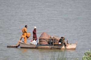 Flood-affected families are using boats to move their loved ones and household belongings across the Chenab River near Head Muhammad Wala as their area is flooded and the gradual rise in floodwaters is forcing them to search for safer ground,leaving thousands homeless due to the floods.
