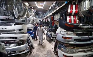 Vendor displaying and selling different vehicles spare parts to attract the customers at Shoba Bazar.