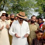 Federal Minister and Chairman Parliamentary Committee for Kashmir Affairs Rana Mohammad Qasim Noon is offering Dua for the flood affectees in Jalalpur Pir Wala