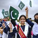 Private school students wave national flags during their visit to Mazar-e- Quaid in connection with Independence Day & ‘Maarka-e-Haq’ celebrations.