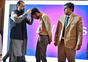 Federal Minister for Overseas Pakistanis and Human Resource Development, Chaudhry Salik Hussain, awarding a gold medal to Abdul Rafay, a student sponsored by the Workers Welfare Fund (WWF), for his historic achievement of winning Pakistan’s first-ever gold medal at the prestigious 36th International Biology Olympiad (IBO) held in the Philippines from July 21 to 27, 2025