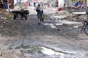 Residents face inconvenience while passing through foul-smelling sewage water accumulated on the main road in Gulshan-e-Kaneez Fatima Block-1, Scheme 33, after heavy rain in the city.