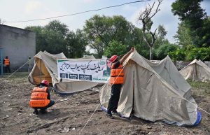 Rescue 1122 personnel set up a relief camp for flood affectees in Mid Ranjha, as rivers rise above dangerous levels due to heavy rains and the opening floodgates by Indian inundating parts of Punjab.