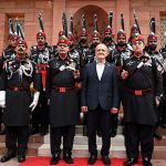 Iran's President Dr. Masoud Pezeshkian poses for a group photograph with Rangers after paying floral tribute at Mazar-e-Iqbal to honor Allama Dr. Muhammad Iqbal, the 'Poet of the East