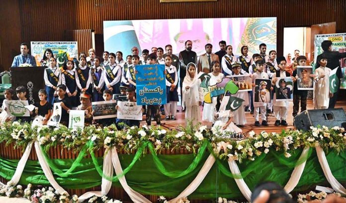 Federal Minister for Overseas Pakistanis and Human Resource Development, Chaudhry Salik Hussain, in a group photo with students, participants, and organizers of the Marka-e-Haq and 78th Independence Day celebrations organized by the Workers Welfare Fund at the National Library Auditorium