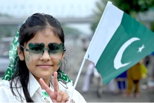 Girls having costumes in the colors of national flag of Pakistan to celebrate the 78th Independence Day of Pakistan in the city