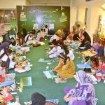 Art students paint their ideas on canvas during a painting competition organized by the Punjab Council of Arts, Faisalabad Division, to mark Independence Day and Marka-e-Haq