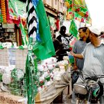 People shop for decorative items for Eid Milad-un-Nabi celebrations at Paper Market